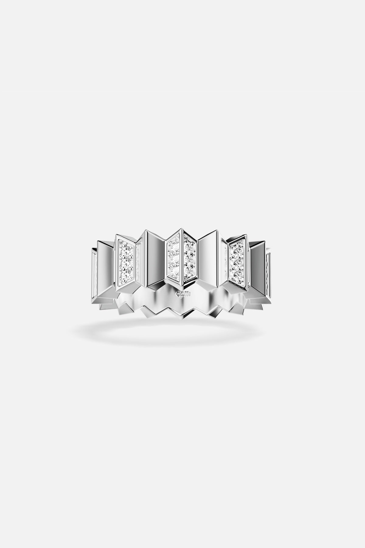 APM Ring in rhodium finish, sculpted geometry with a radiant, architectural edge.