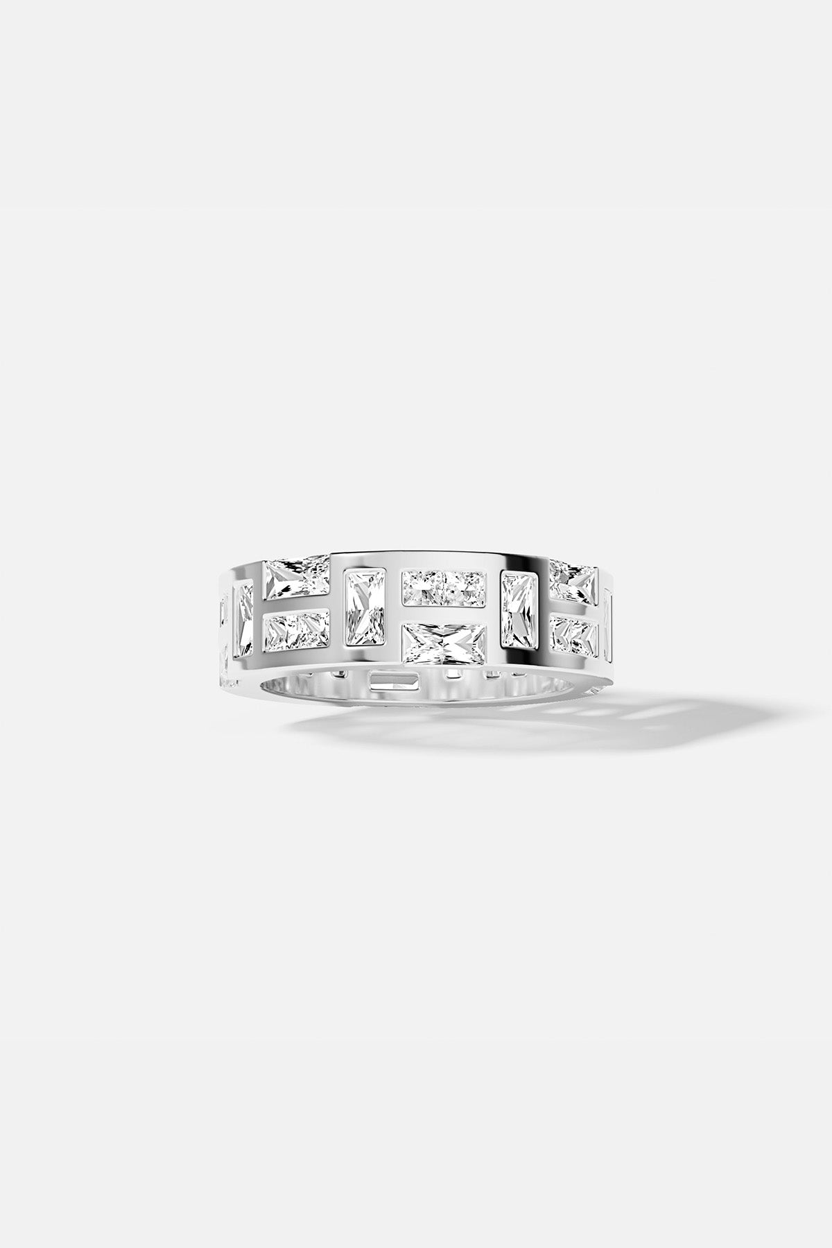 APM Ring in rhodium finish, luminous baguette stones aligned with modern architectural grace.