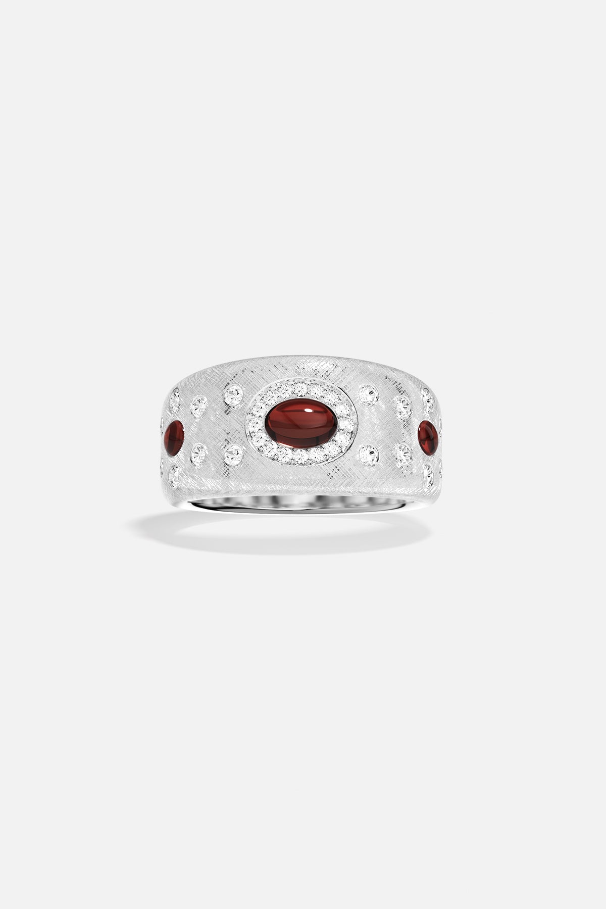APM Monaco ring, brushed rhodium finish glowing with deep red accents, timeless allure.