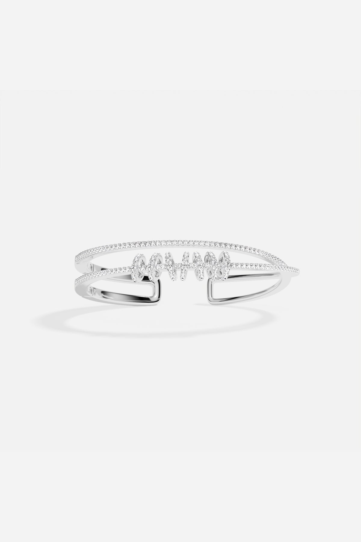 APM Monaco bangle in rhodium finish, sparkling with effortless modern grace.