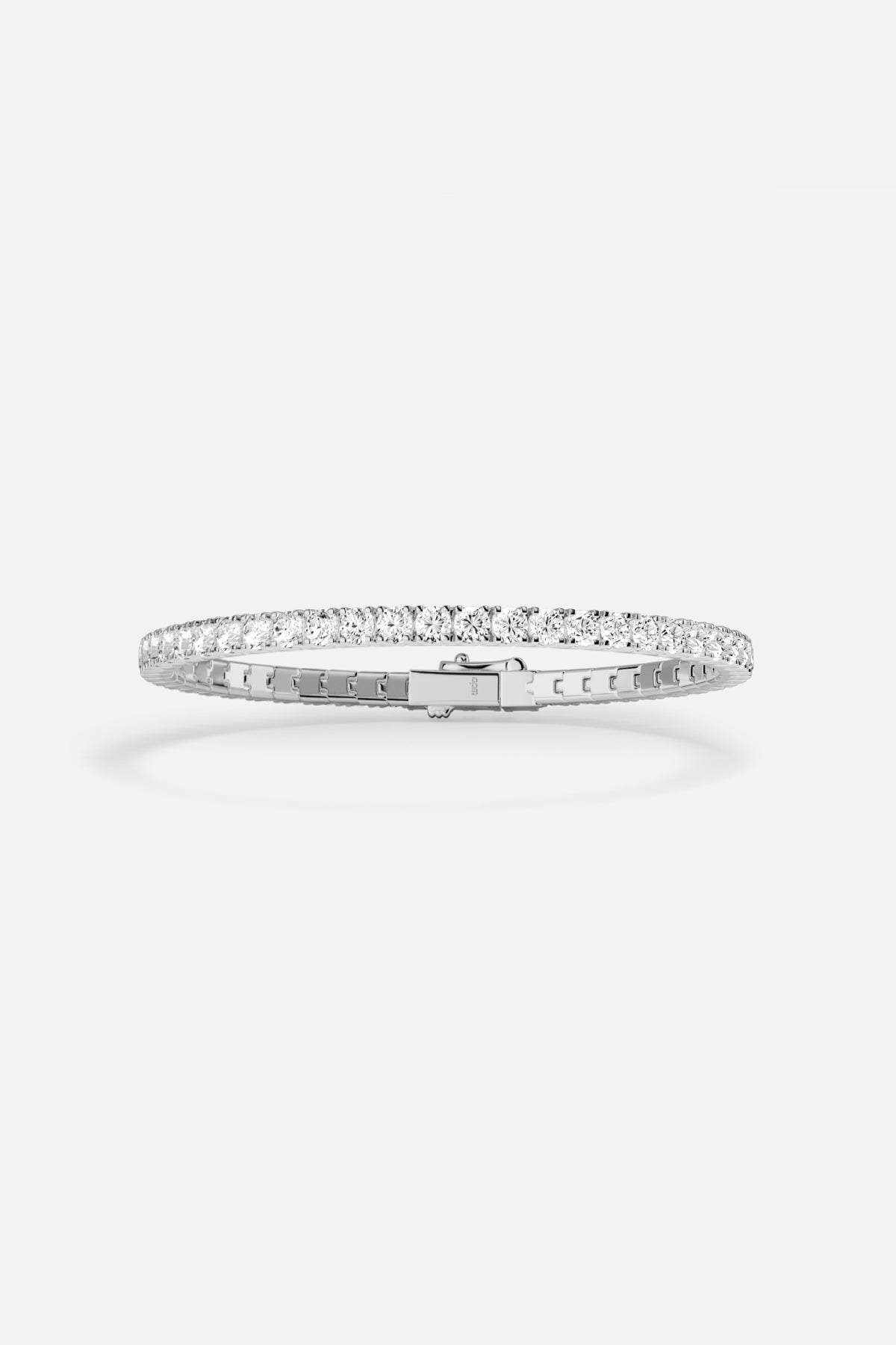 APM tennis bracelet in rhodium finish, a timeless sparkle for effortless elegance.