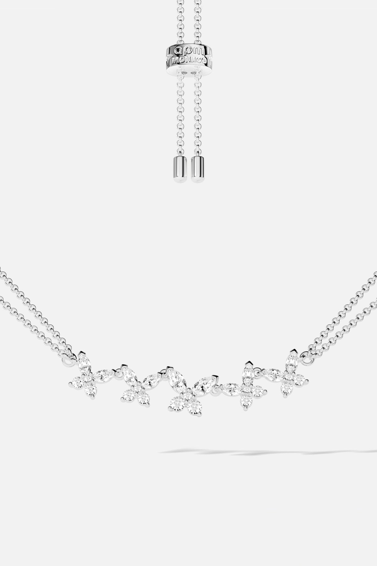 APM Monaco butterfly bracelet, a delicate rhodium finish flutter of shimmering elegance.