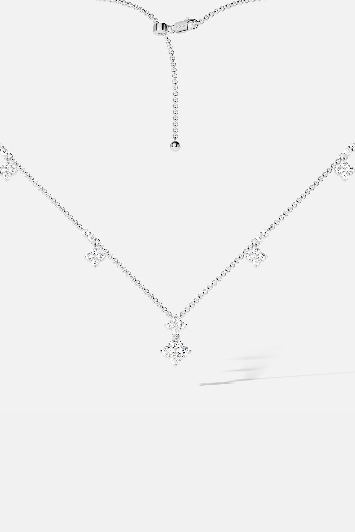 APM Necklace with delicate sparkling charms, a whisper of modern elegance in rhodium finish.