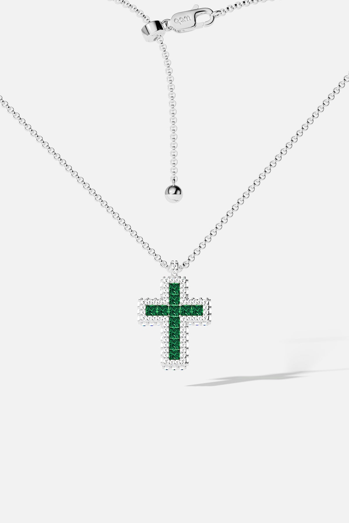 APM Cross Necklace, a luminous green statement with rhodium finish brilliance.