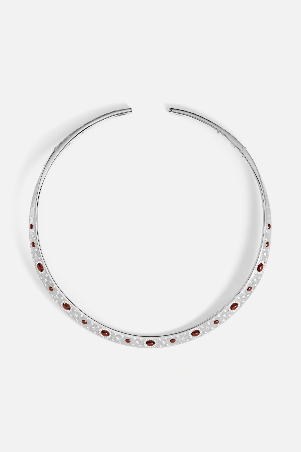 APM open collar necklace in rhodium finish, glowing with deep red accents.