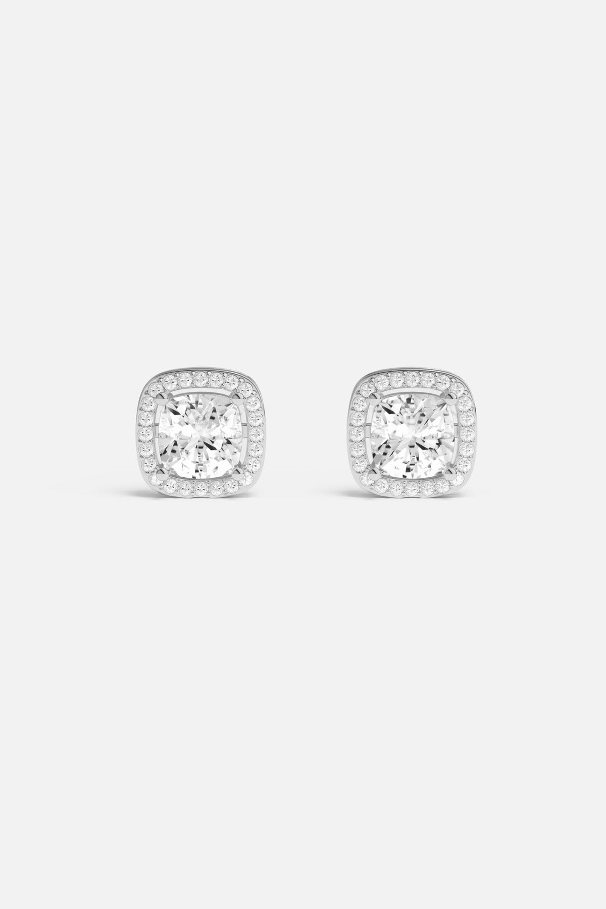 APM Stud Earrings, cushion-cut brilliance framed in rhodium finish, timeless everyday sparkle.