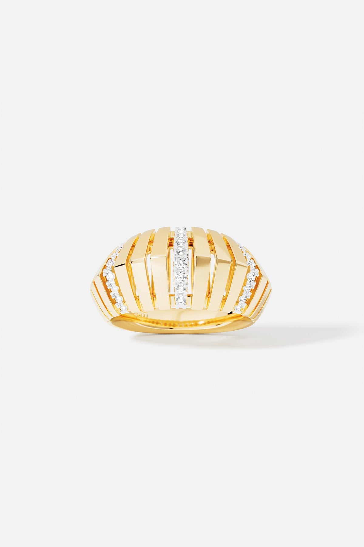 APM Ring, a golden dome sculpted with radiant lines and quiet sparkle.