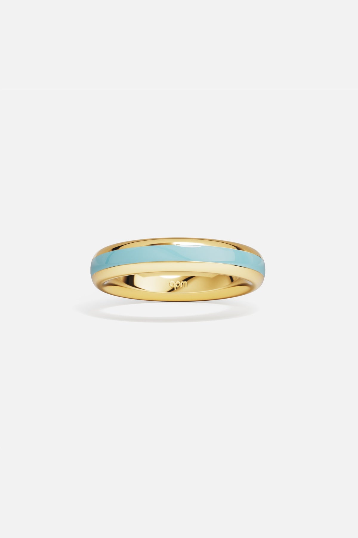 APM Ring in golden hues with a soft turquoise line, quietly luminous.