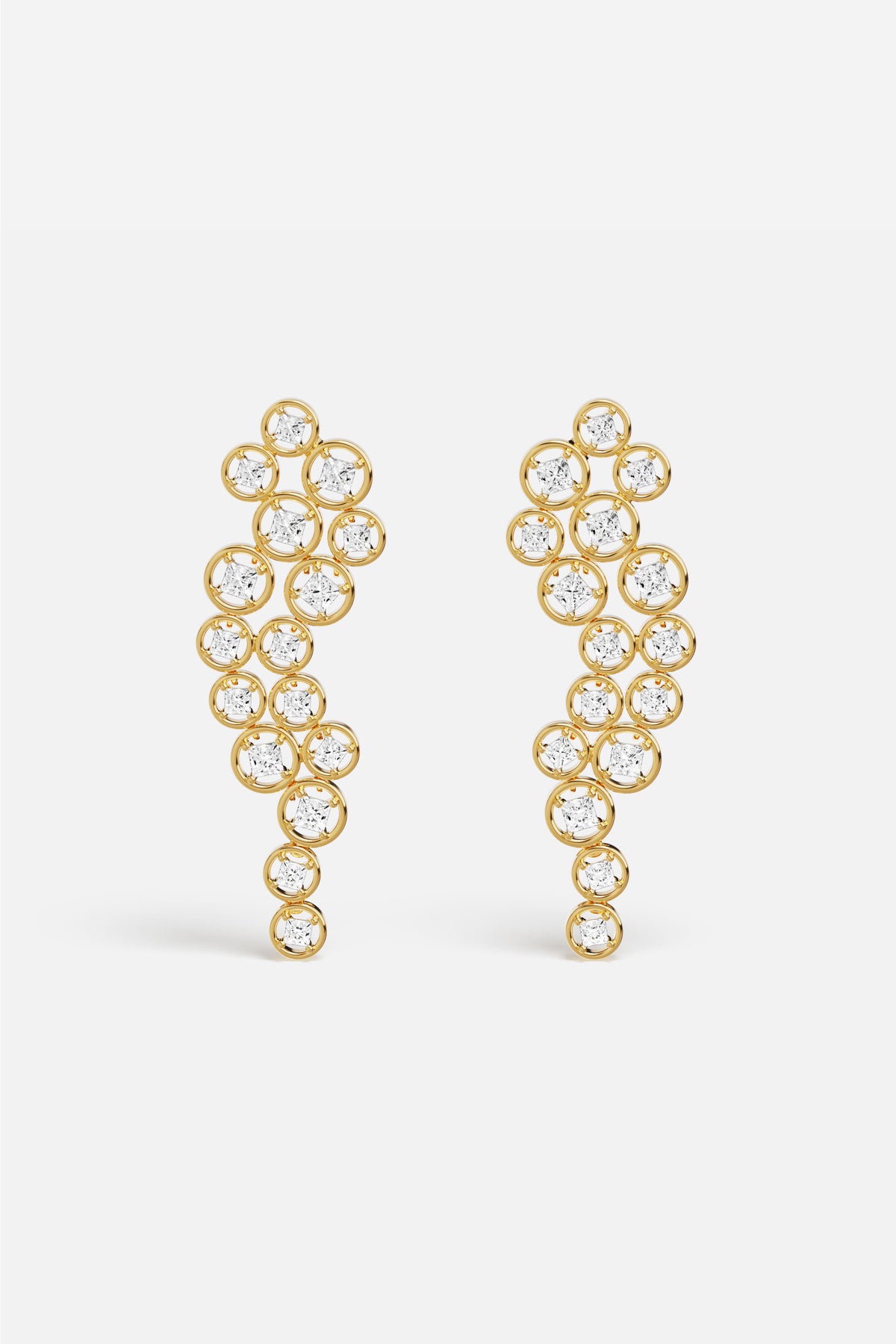 APM Earrings in golden color, a cascade of light with effortless elegance.