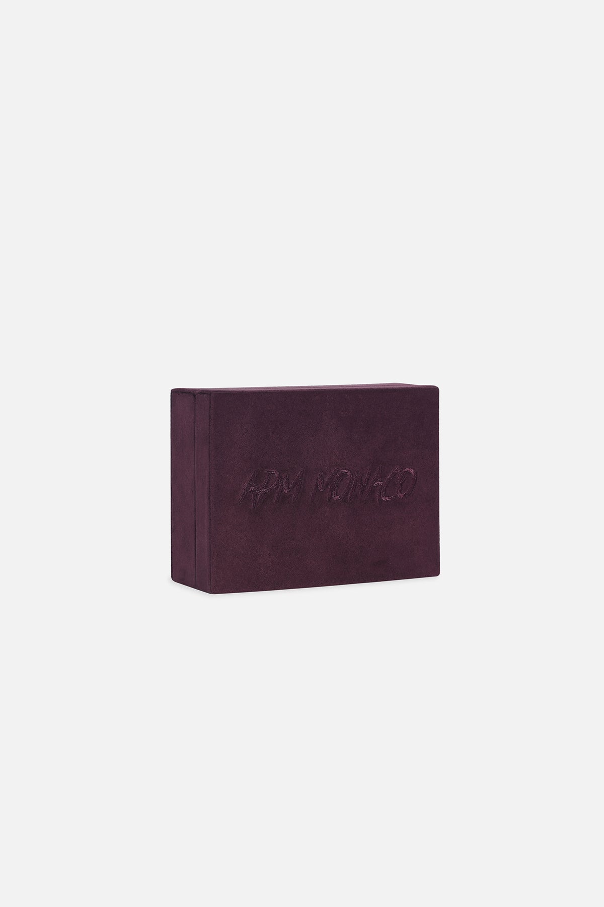 APM Monaco velvet jewelry box in deep burgundy, a signature touch of quiet luxury.