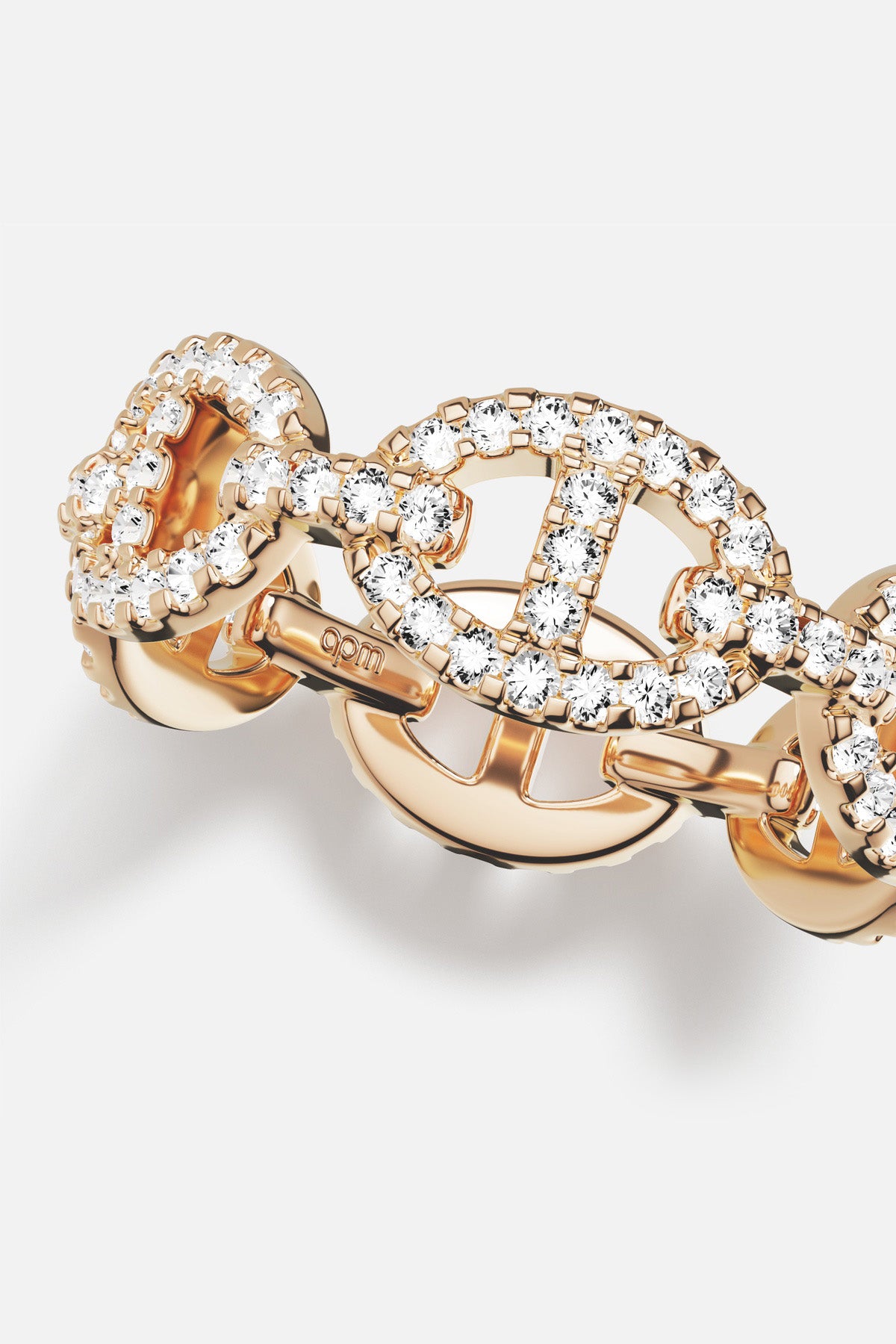 APM Morse Ring, a golden shimmer of linked brilliance and effortless allure.