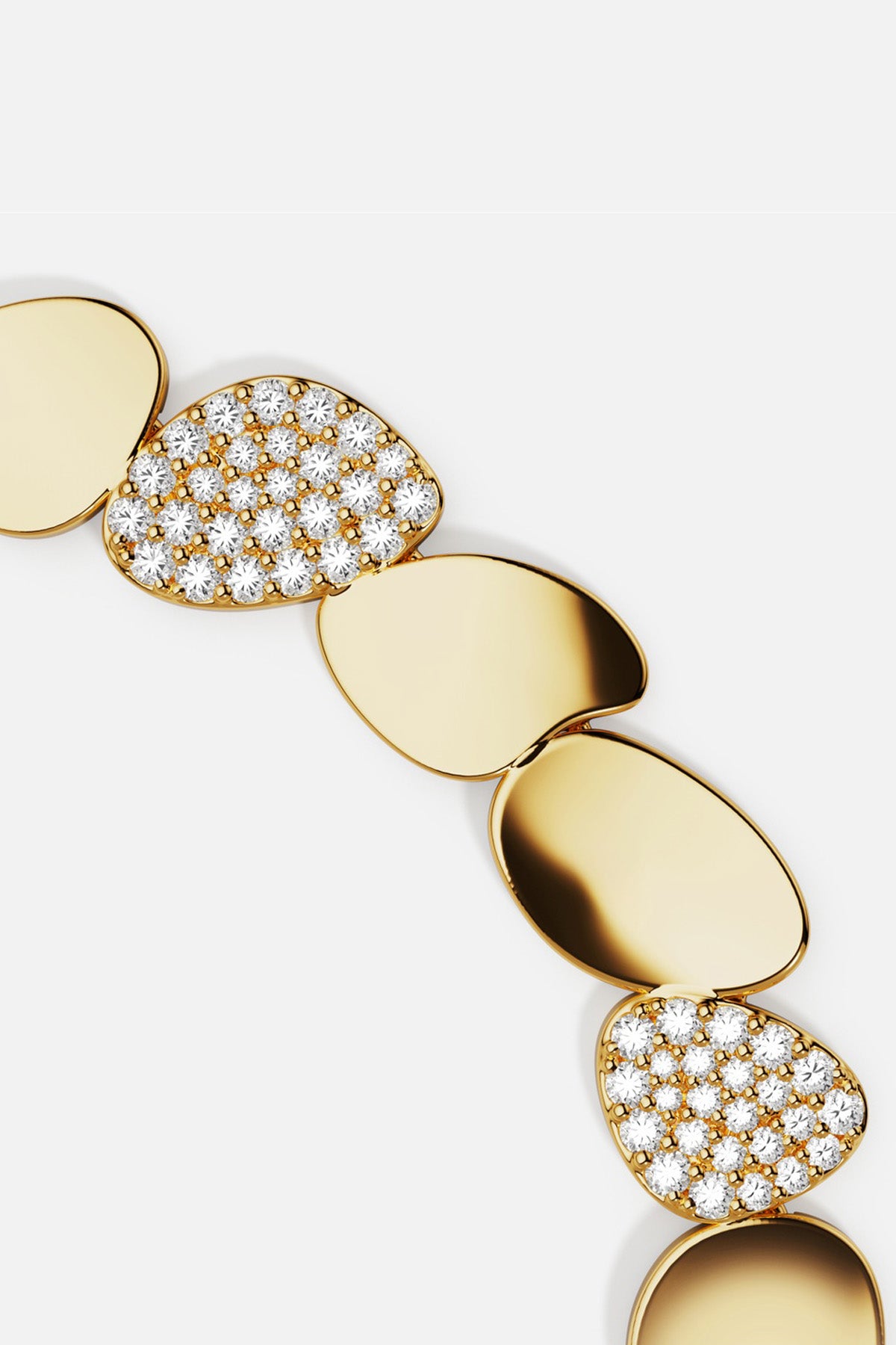 APM Monaco bracelet, golden pebbles and shimmering pavé, effortlessly modern elegance.