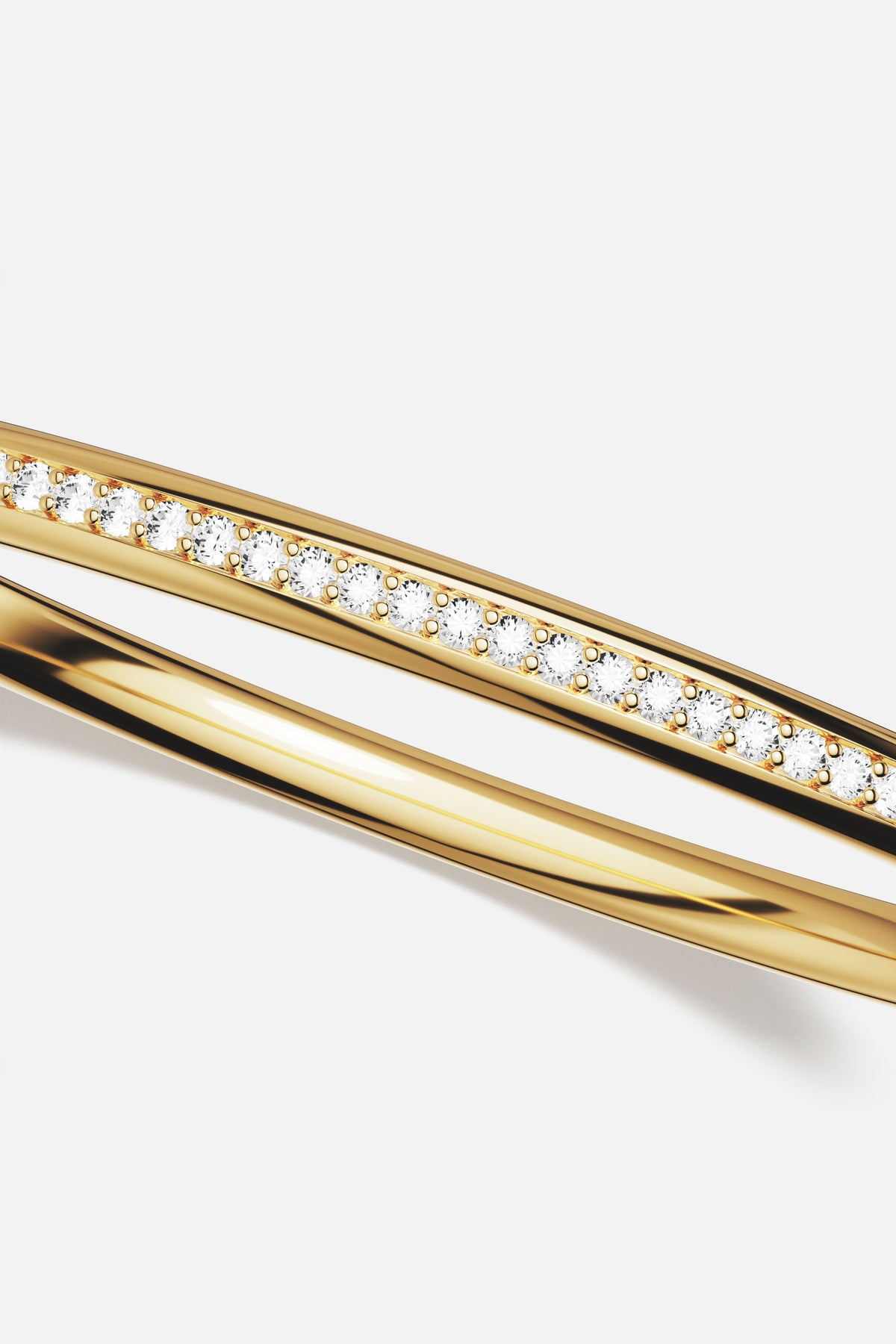 APM Bangle Duo, golden lines meeting quiet sparkle for effortless everyday luxury.