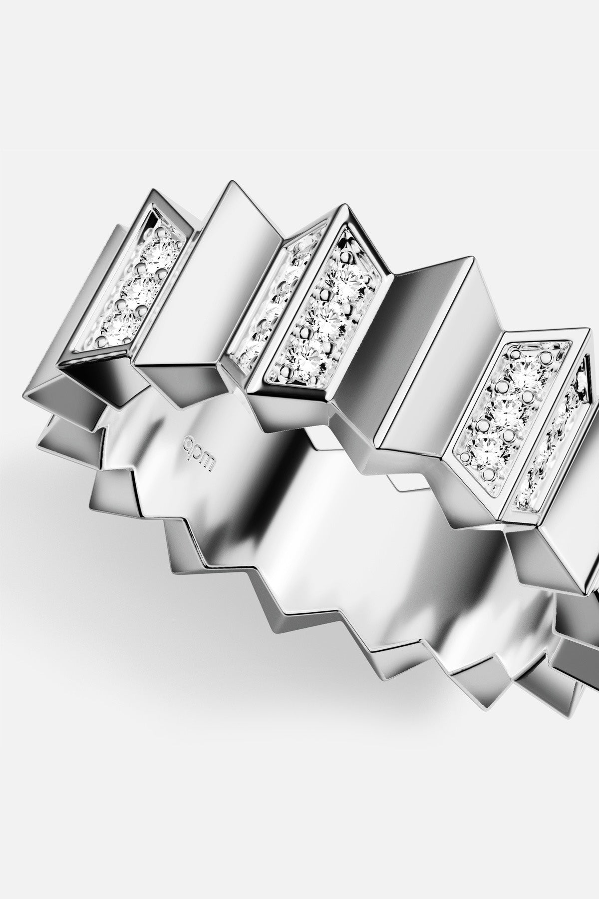 APM Ring in rhodium finish, a bold zigzag statement with quiet sparkle.