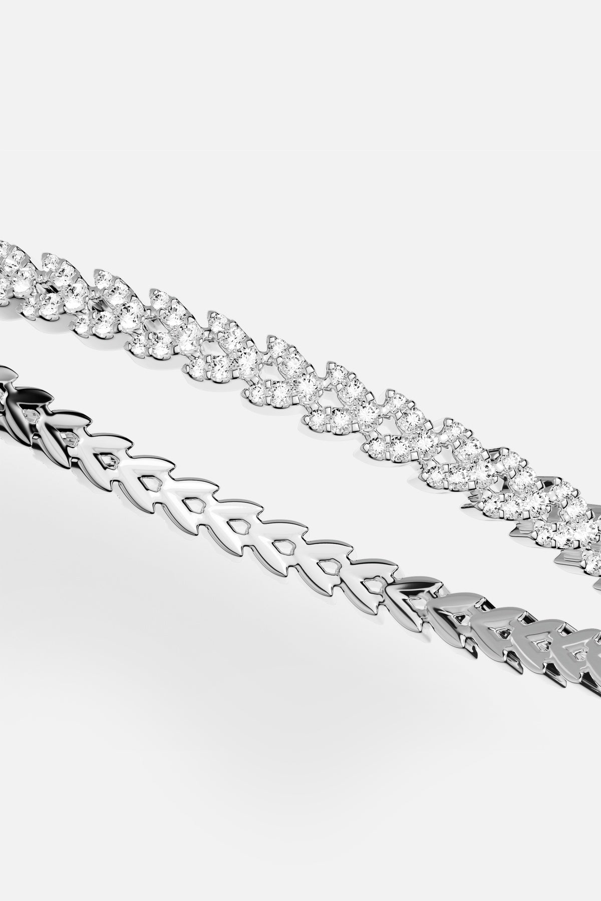 APM Bracelet duo in rhodium finish, sculpted links and shimmering pavé, effortlessly bold.