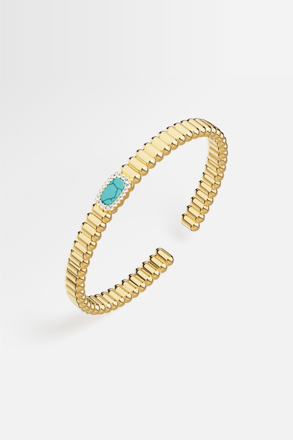 APM Bangle in golden hue, a turquoise whisper framed in quiet brilliance.