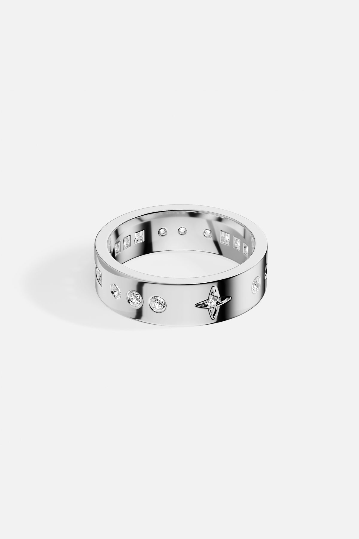 APM Ring in rhodium finish, a celestial whisper of stars and light.