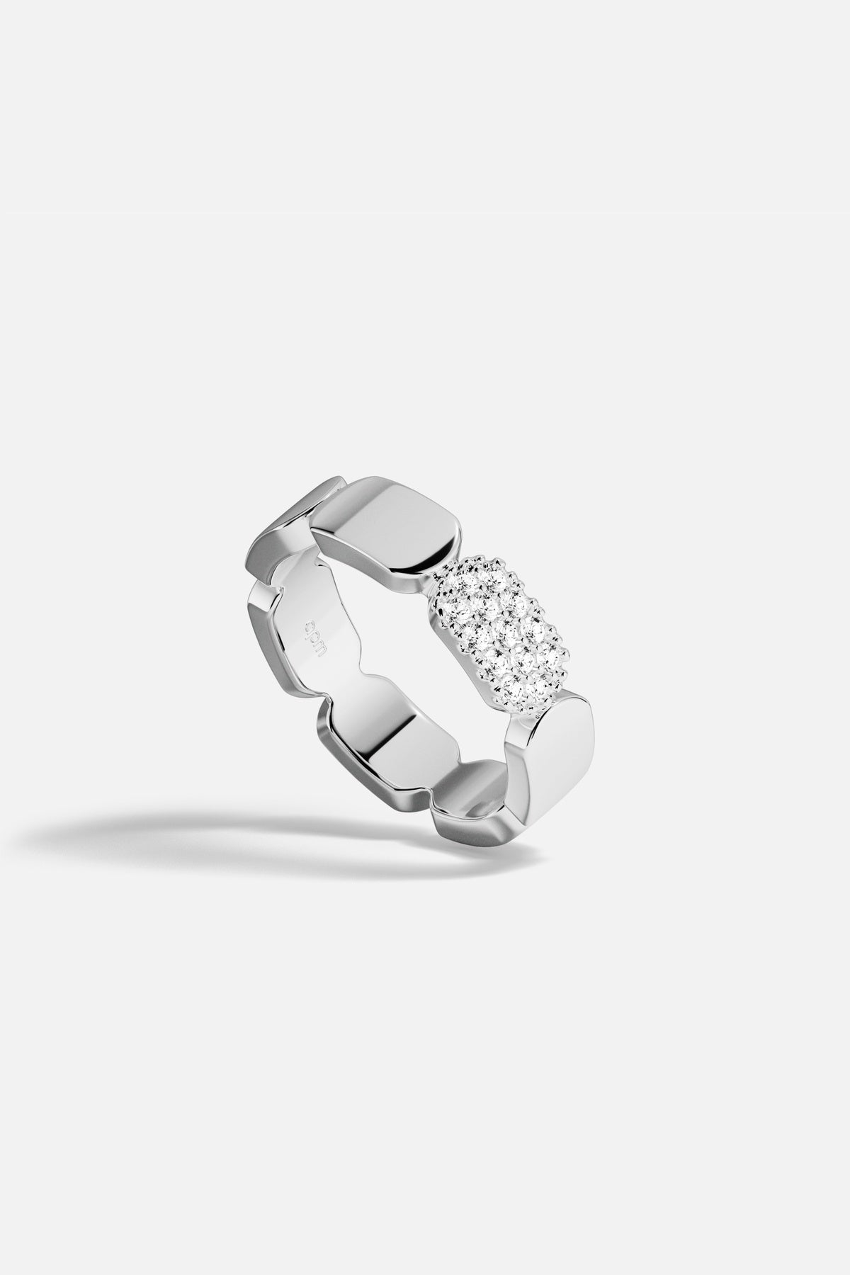APM Ring in rhodium finish, sculpted links meeting a shimmer of pavé brilliance.