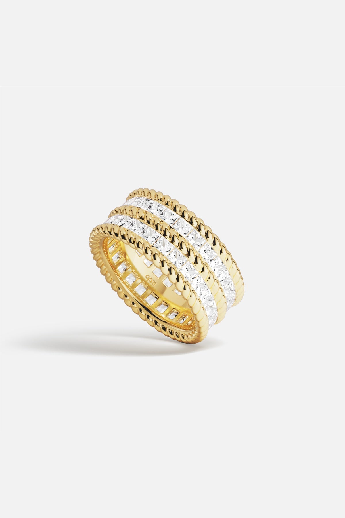 APM Ring in golden color, radiant sparkle framed by soft beaded edges.