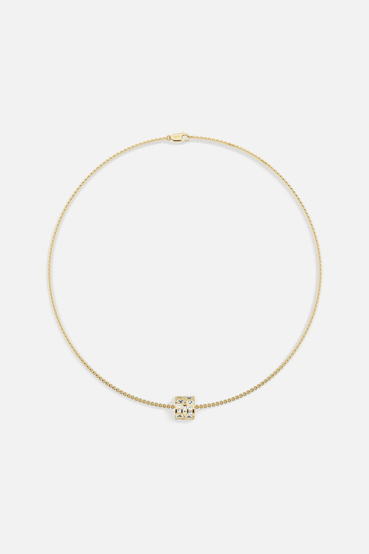 APM Necklace in golden color, a luminous charm for effortless everyday elegance.