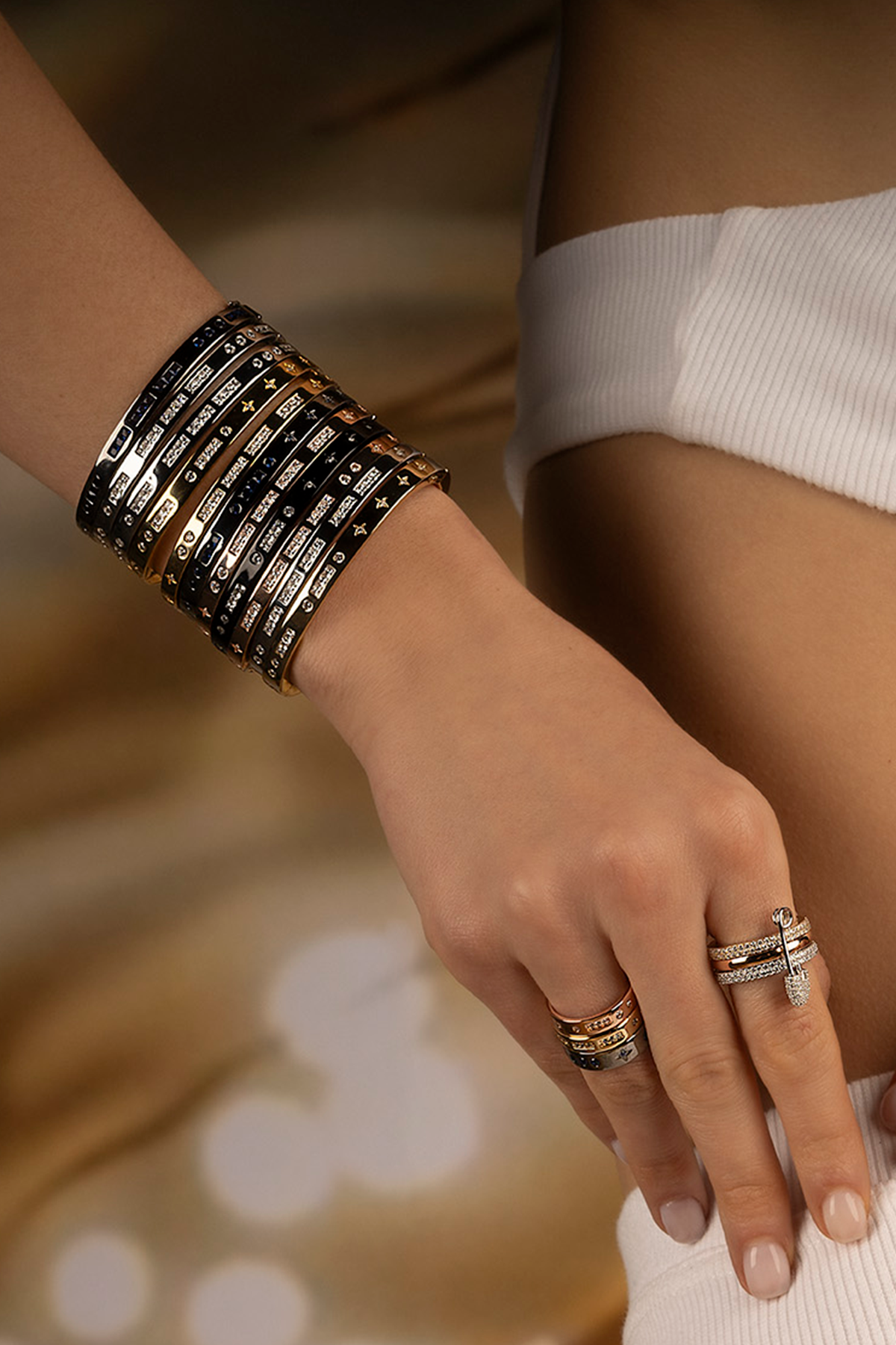APM Monaco BONHEUR Morse Code Bangle in Yellow Gold worn on hand