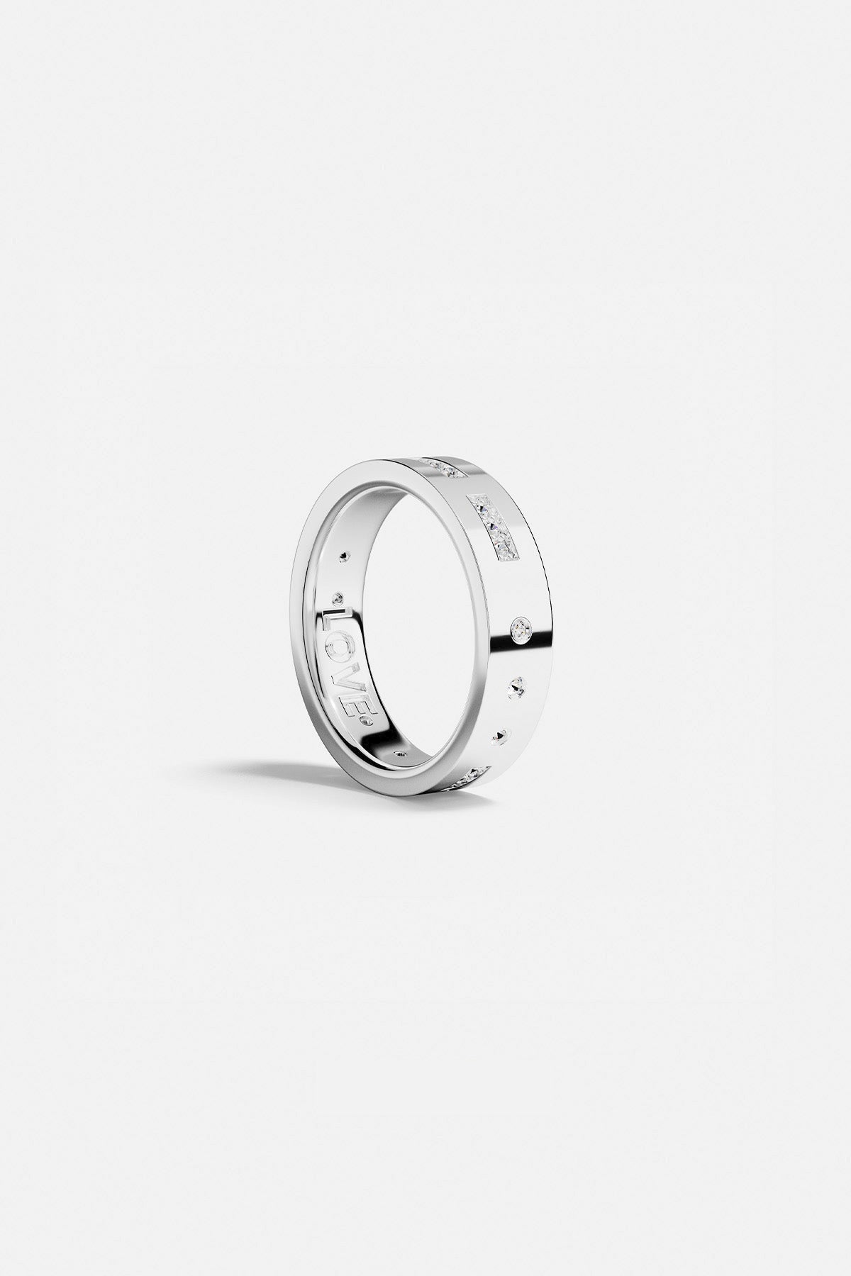Rings APM Monaco. White metal ring with pavé diamonds on a slim band that spells out 'LOVE' in morse code.