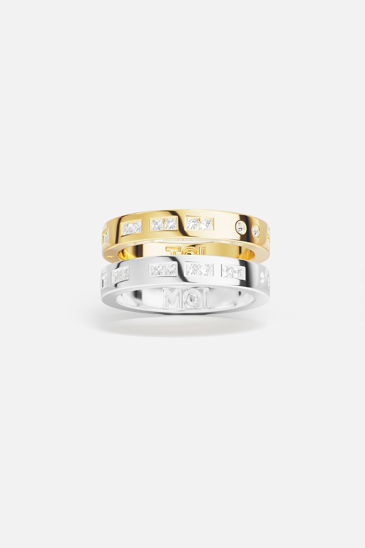 Rings APM Monaco: two stacked rings, yellow gold and white gold, white cubic zirconia, one with MOI engraving.