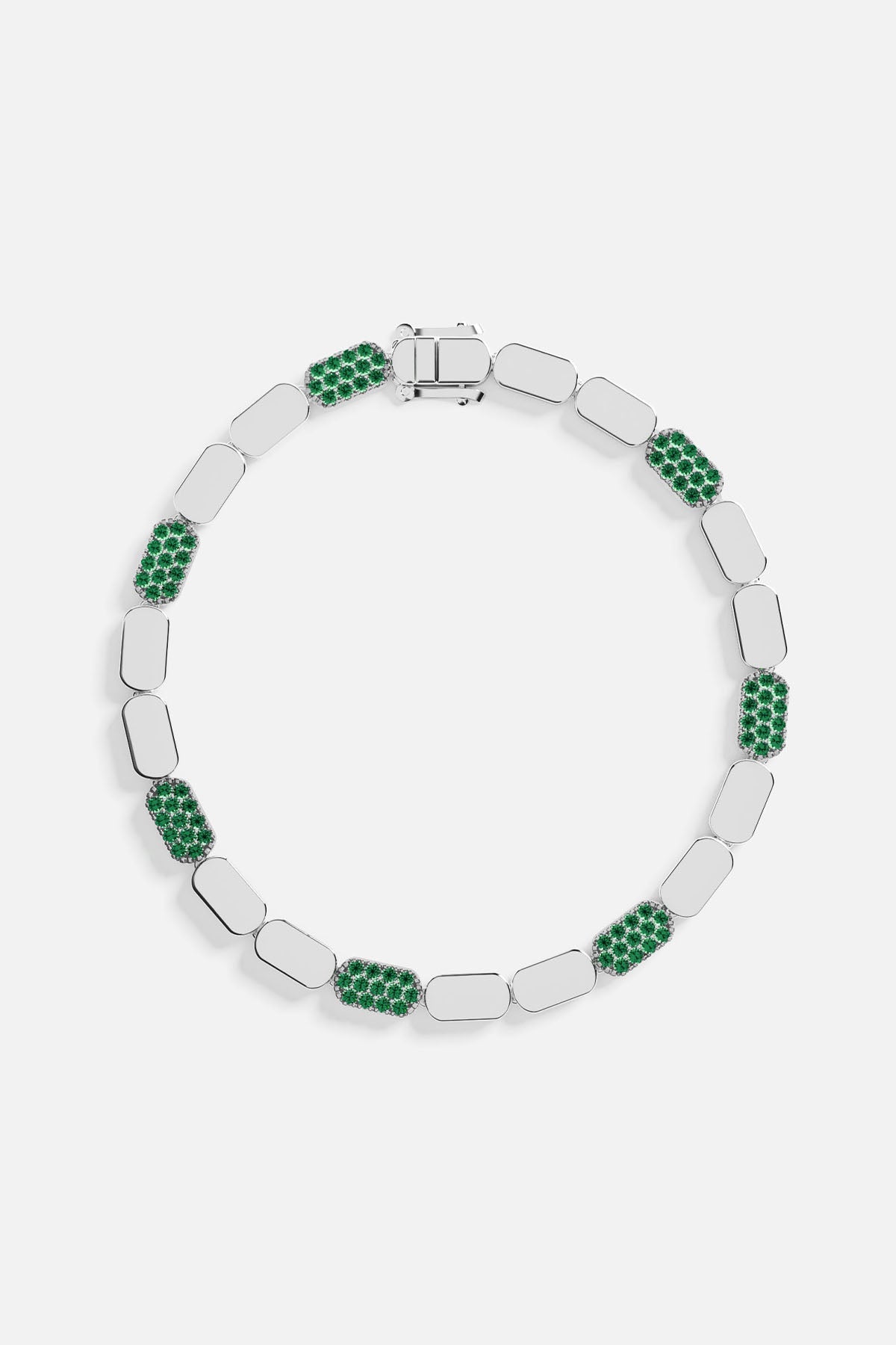 Silver bracelet with green stones on a white background