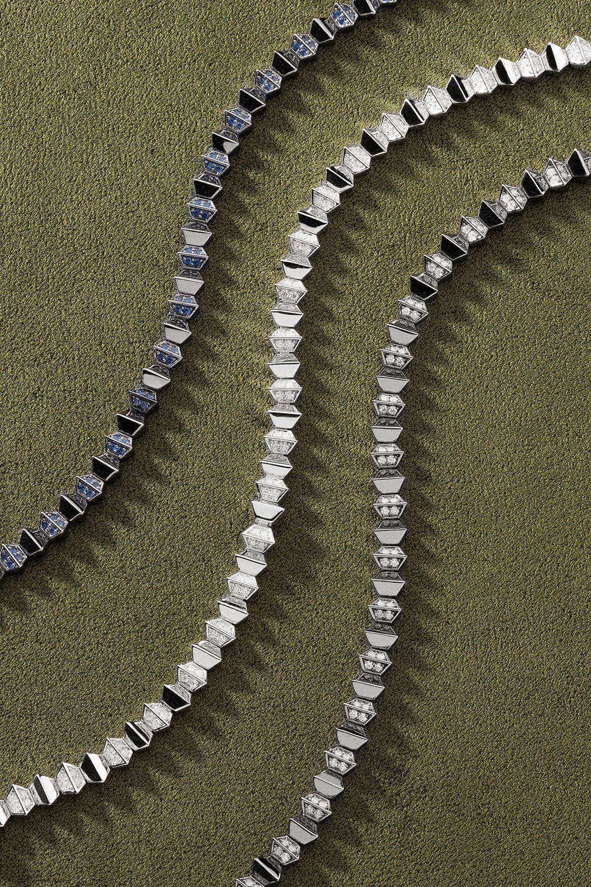 Silver Bracelets on a green background
