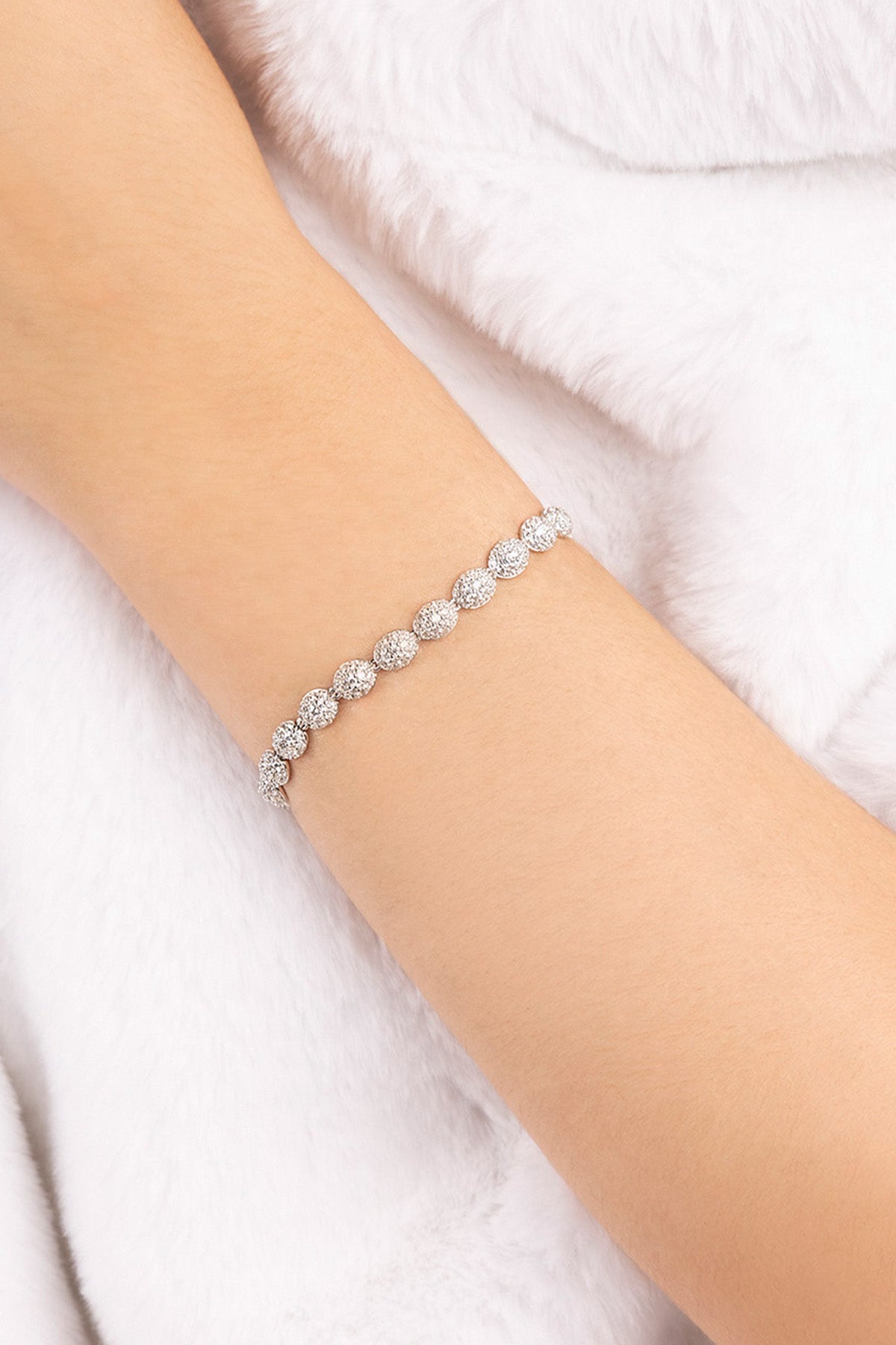 APM MONACO pave bracelet in silver on model's wrist