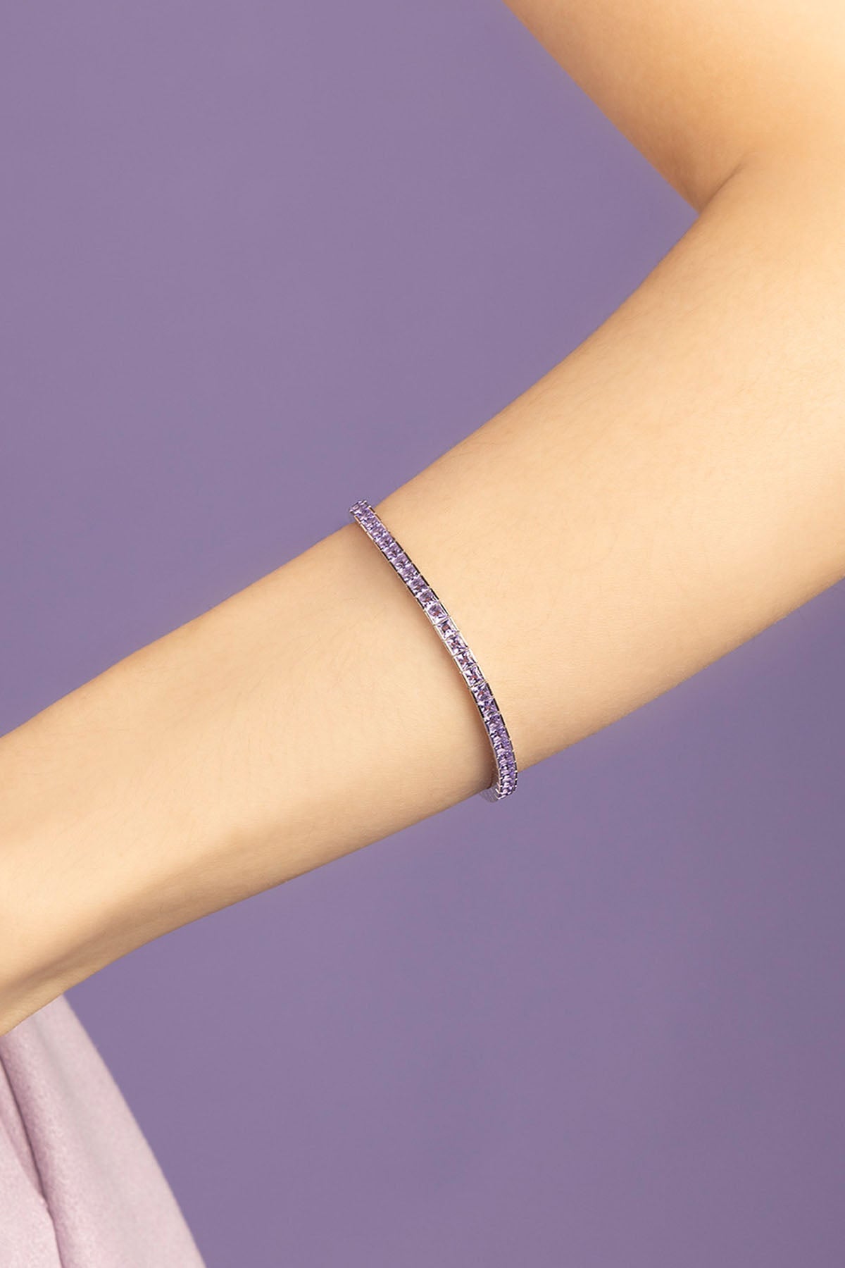 APM Monaco Purple paved bracelet on purple background
