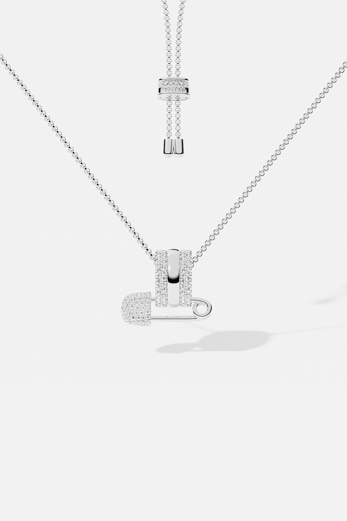 Necklaces APM Monaco white metal adjustable chain with a small safety-pin charm.