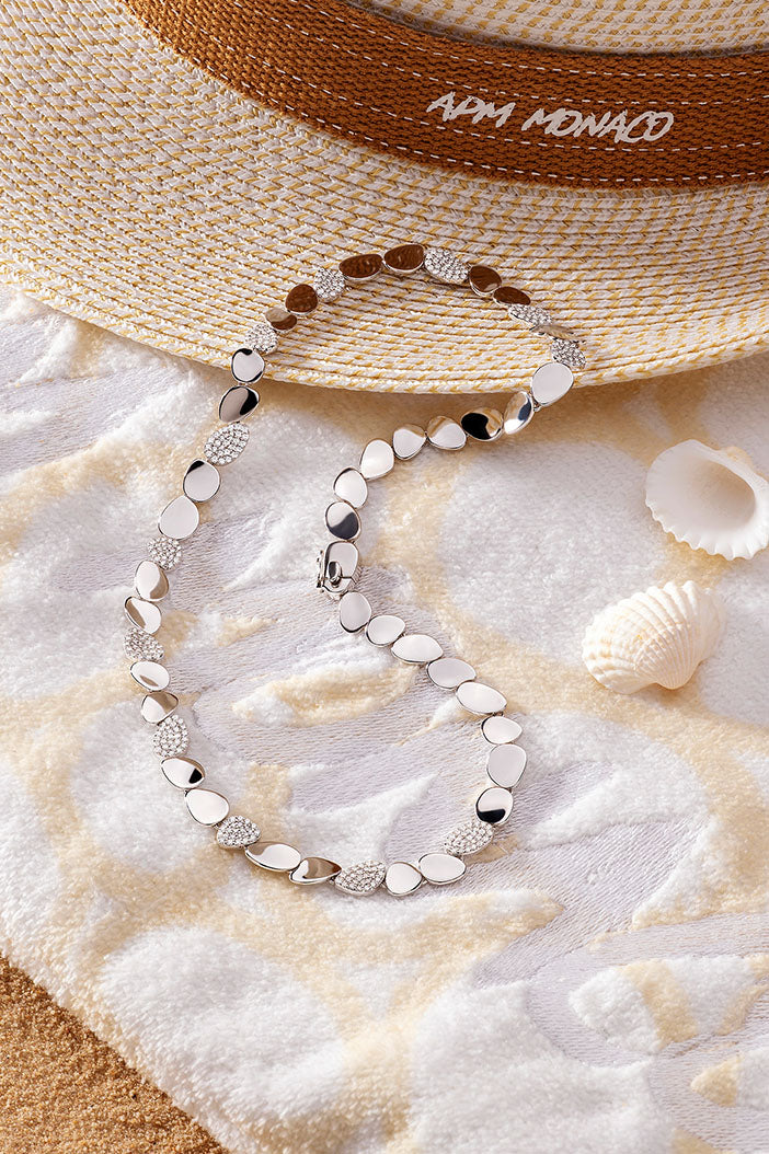 APM Monaco Galet Choker in silver on soft beach