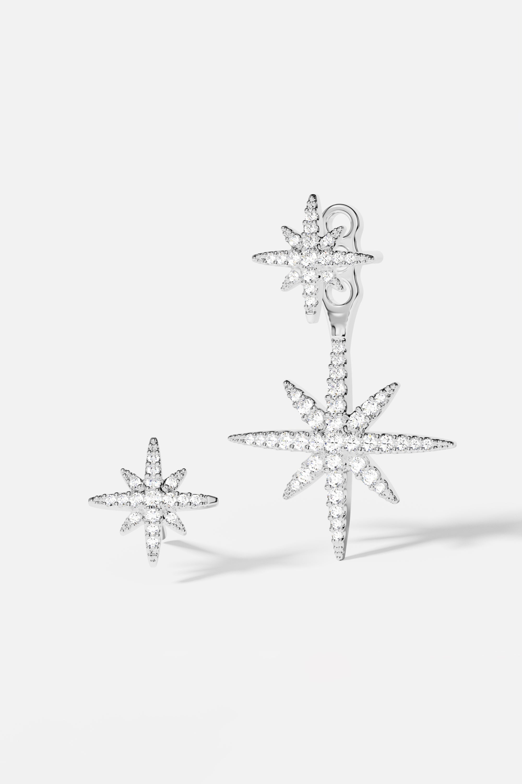 Earrings APM Monaco meteorites asymmetric underlobe, metallic silver tone with irregular meteorite-inlay accents.