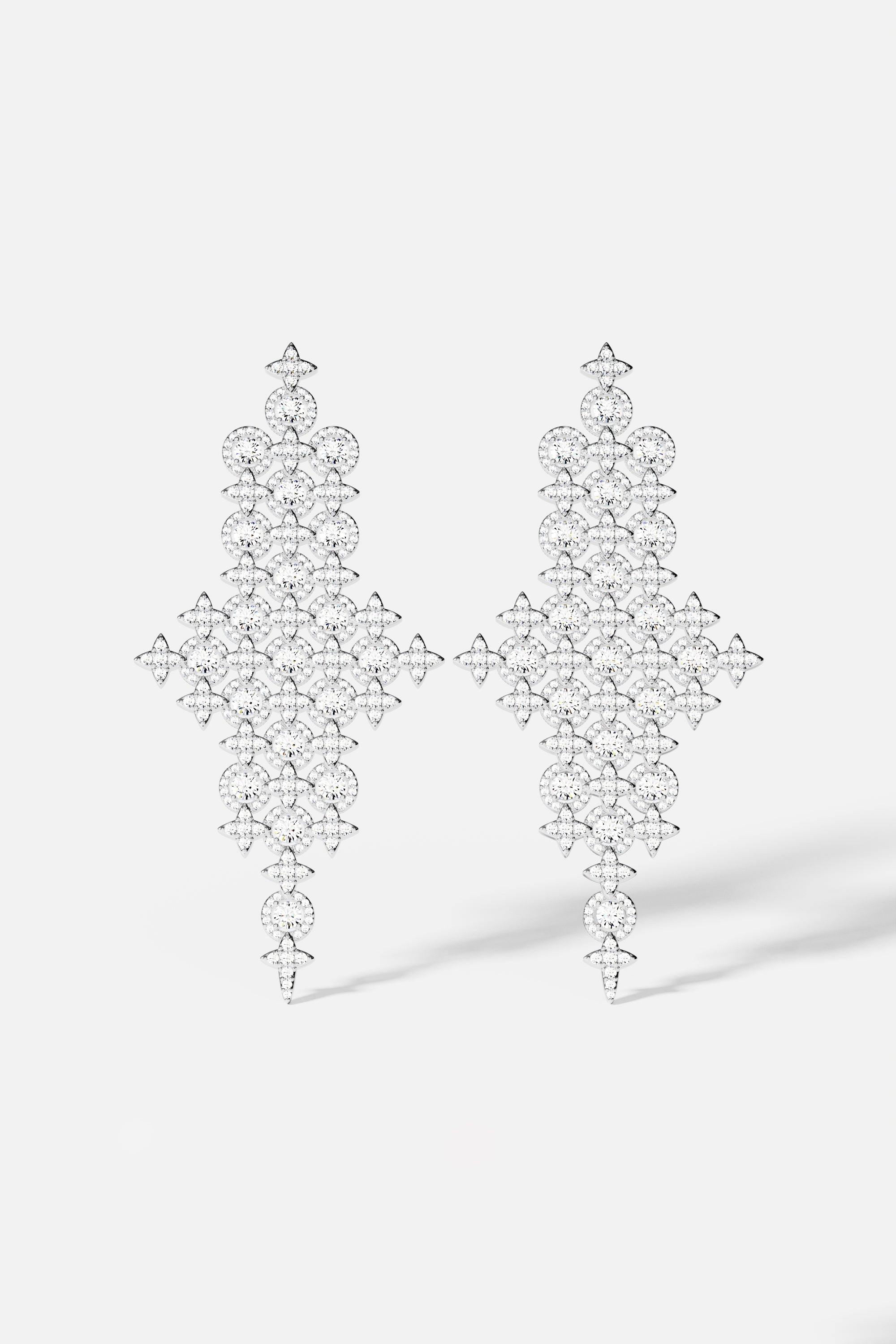 Earrings APM Monaco: white pavé diamond drop chandelier statement earrings.