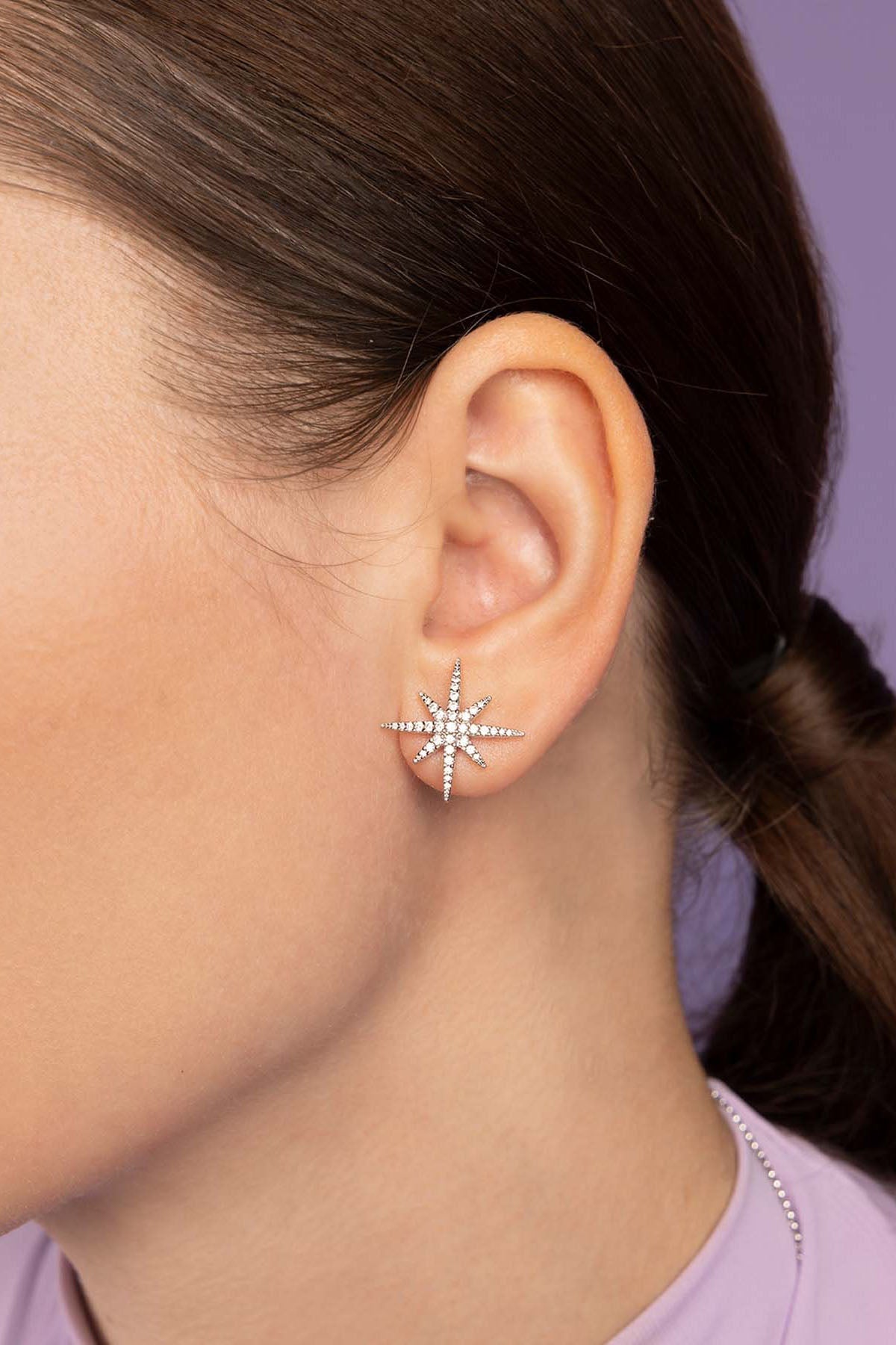 APM Monaco Meteorites Silver Stud Earring worn on model with lilac background