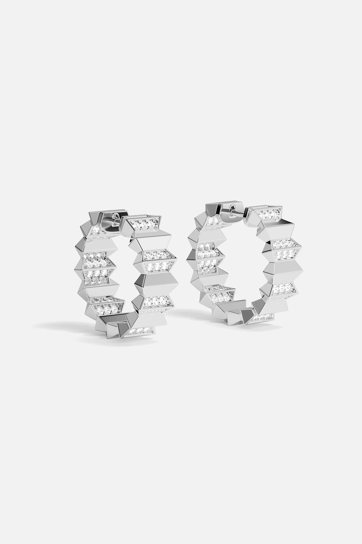 Pair of silver hoop earrings on a white background