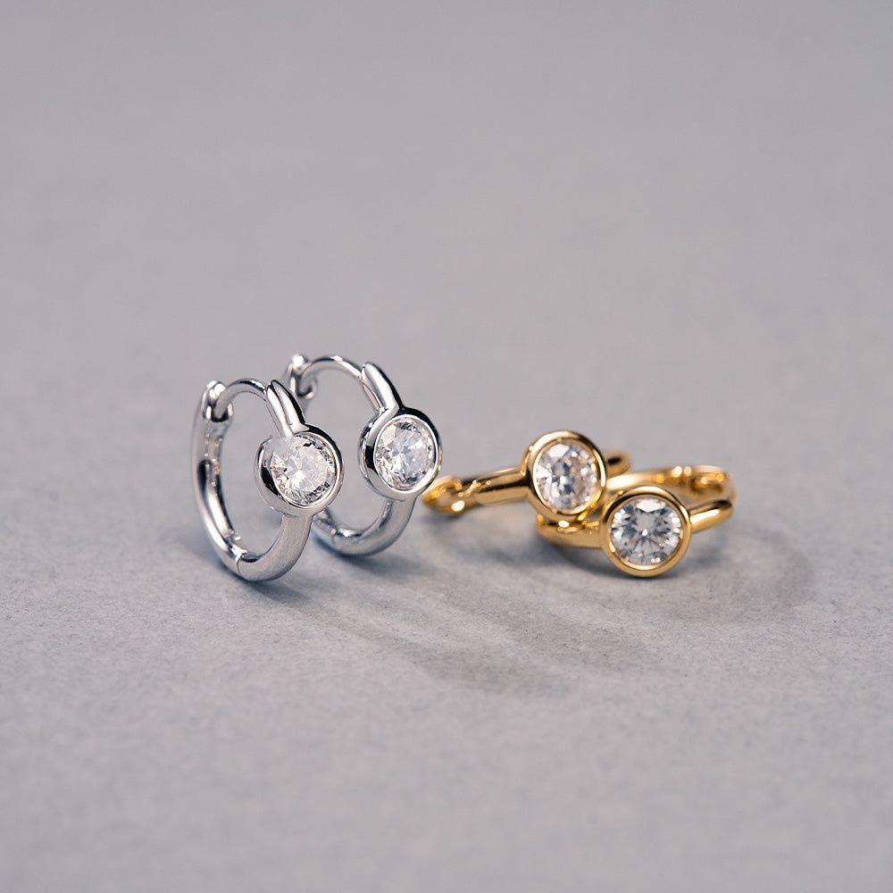 APM Monaco Round Diamond Huggie Earrings