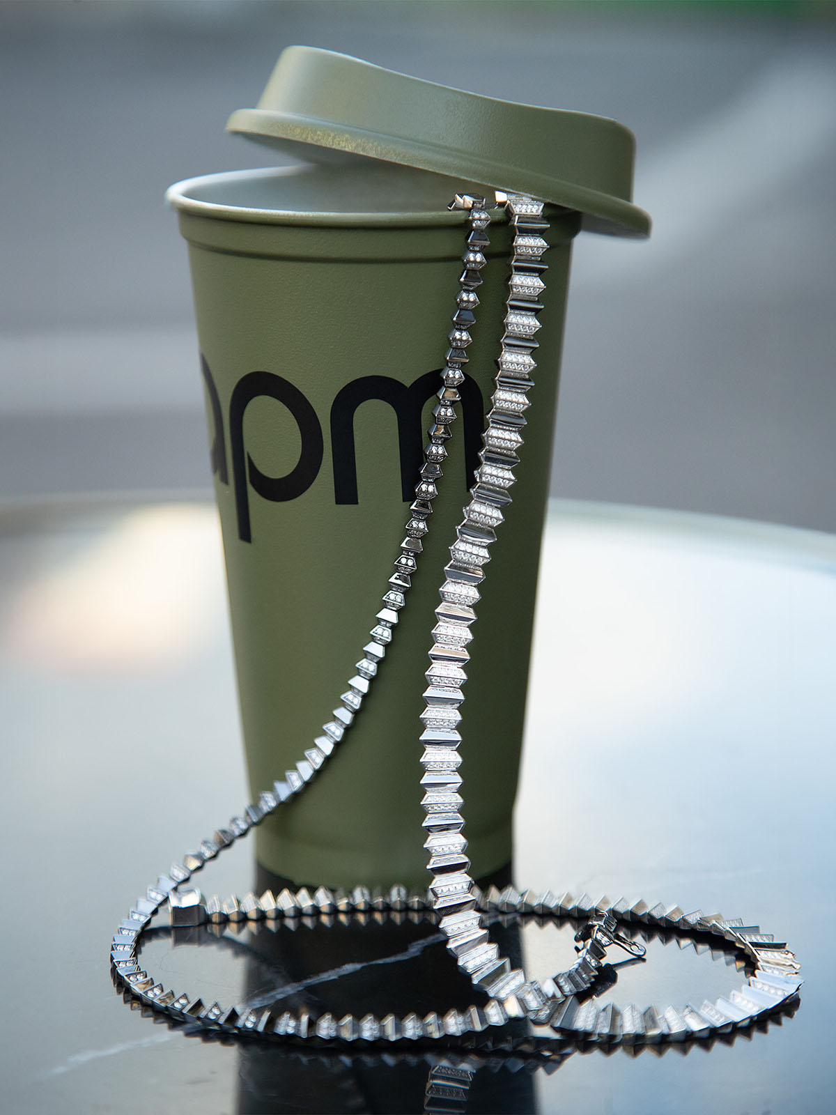 APM MONACO green cup with a lid and a decorative choker from up and down collection