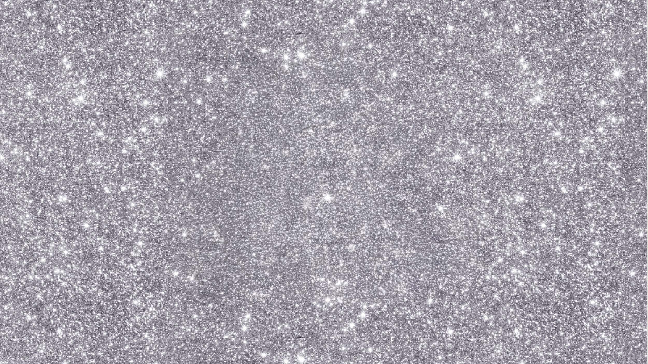 Silver glitter texture on a sparkling background