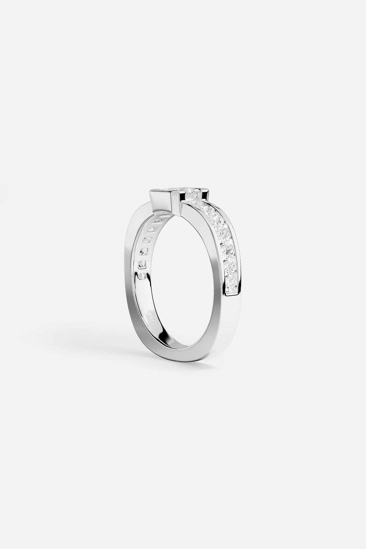 alloy ring with embedded stones on a white background