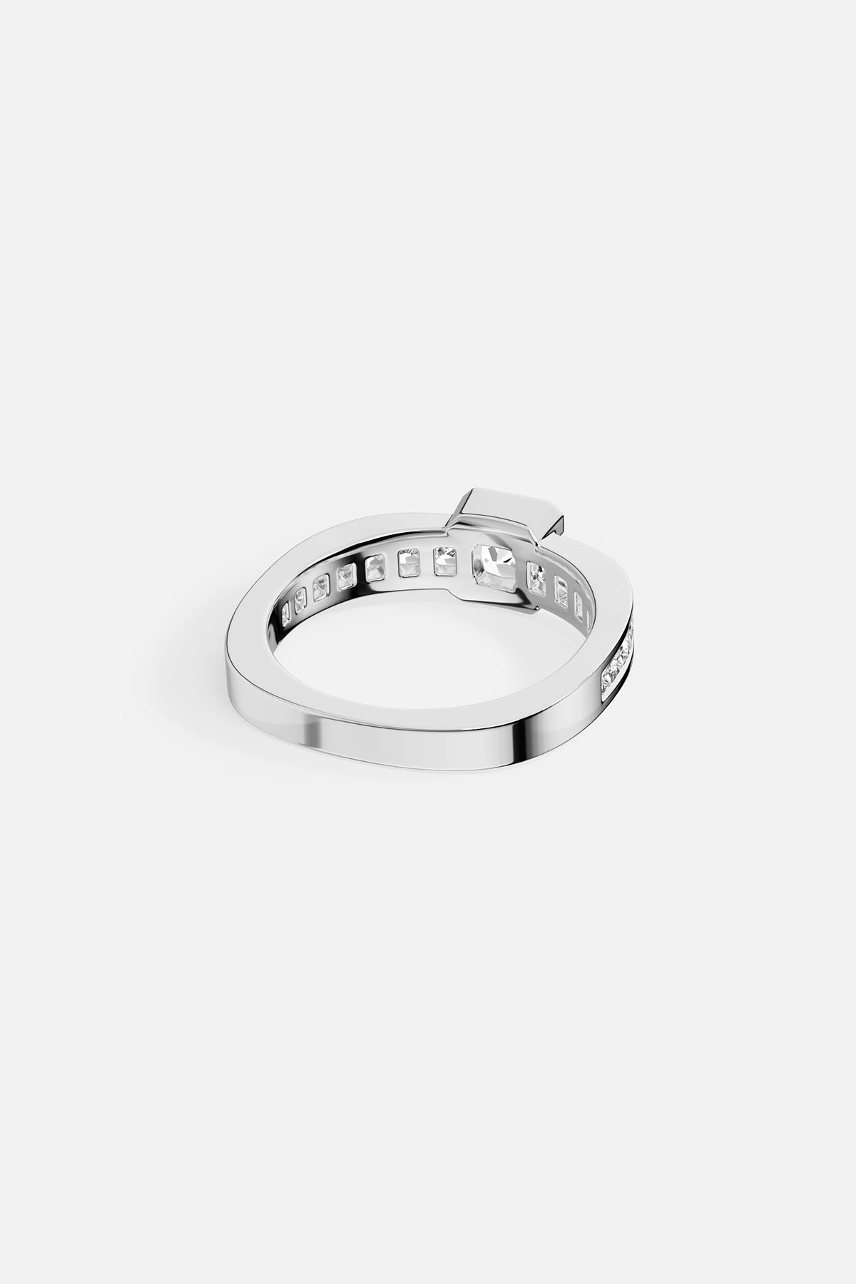 Alloy ring paved with stones on a white background
