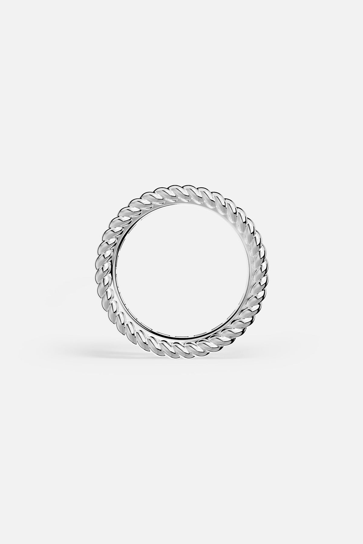 Silver ring with a textured design on a white background