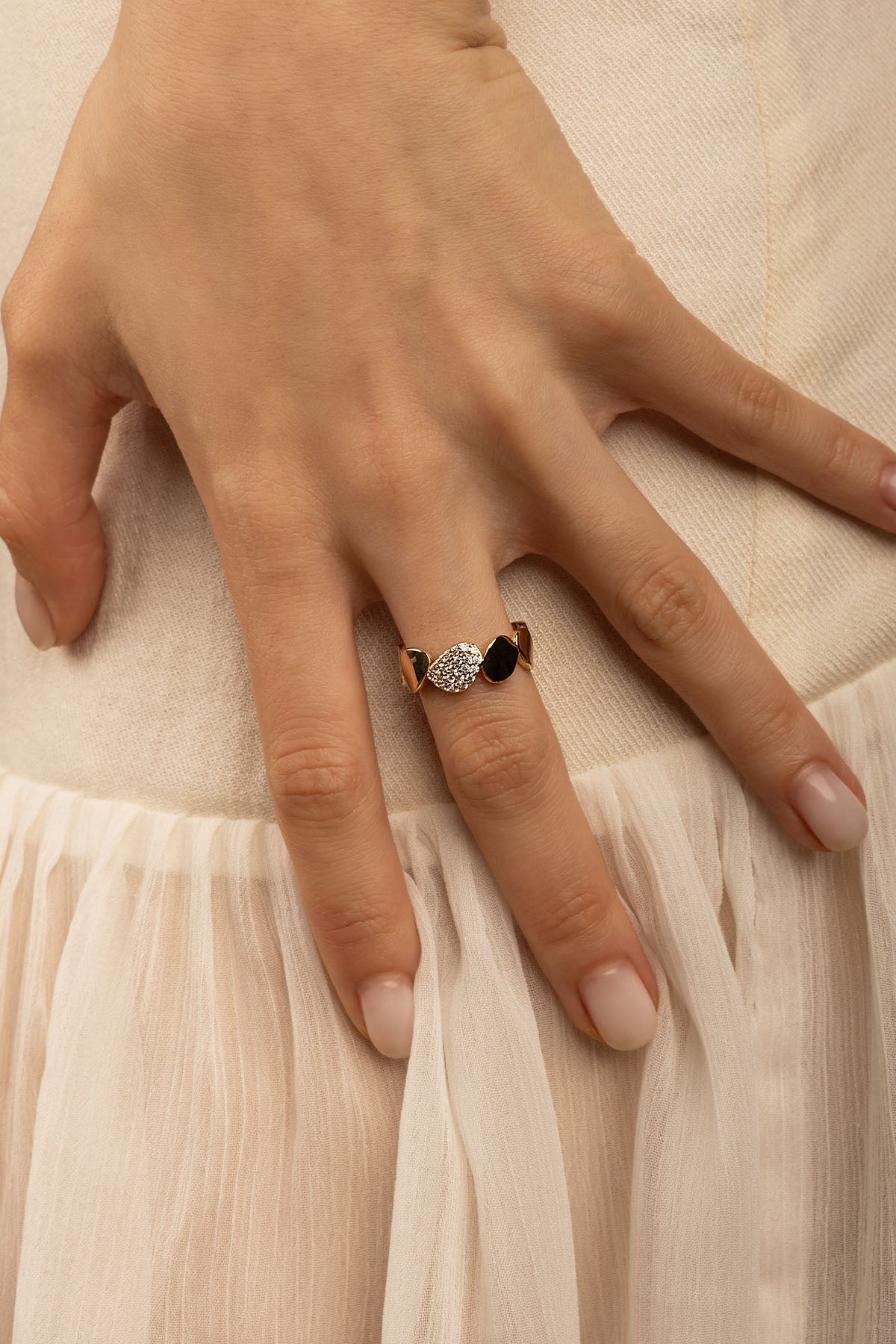 Rings APM Monaco, yellow gold ring with alternating white and black stones.