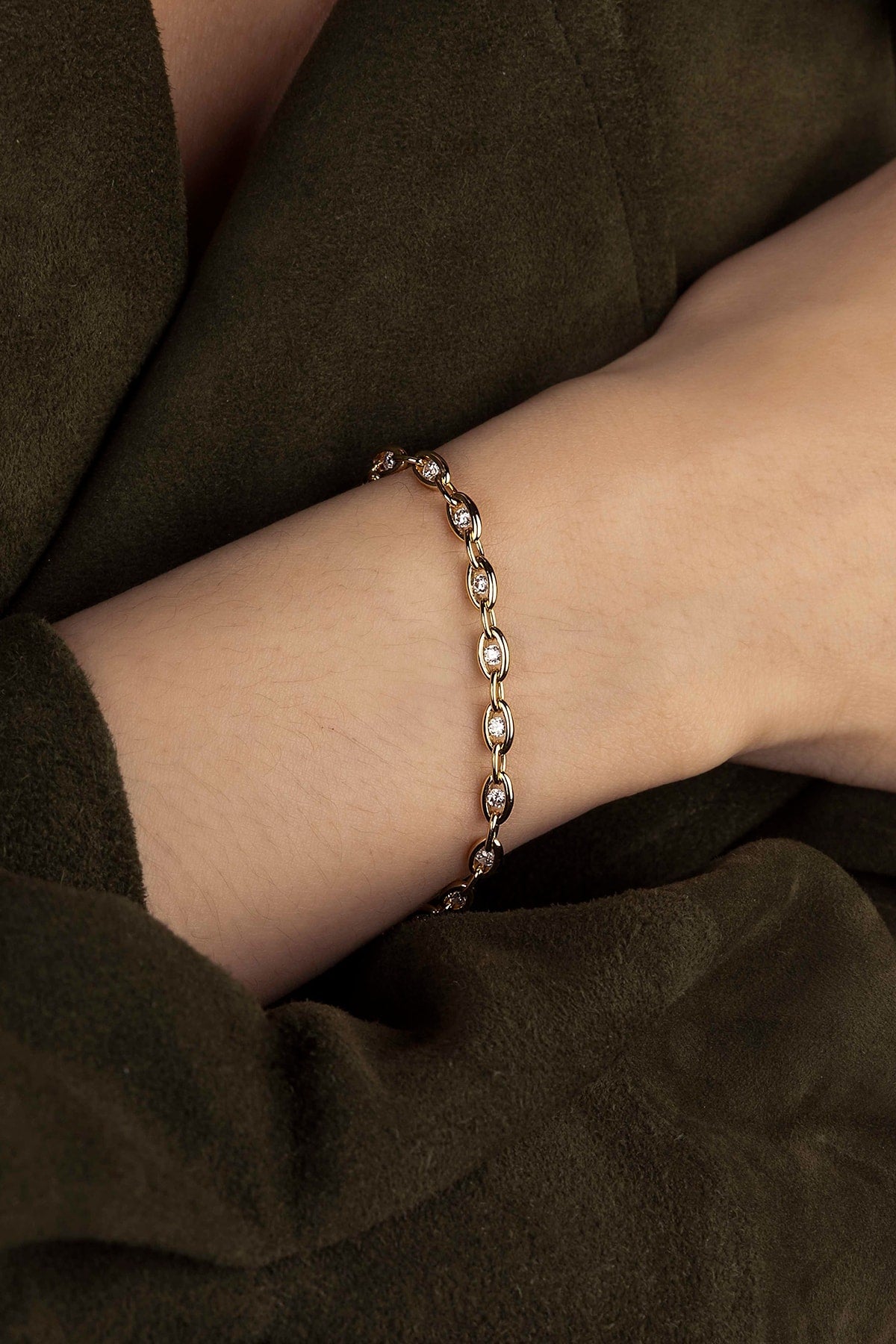 Bracelet on a wrist with a dark background