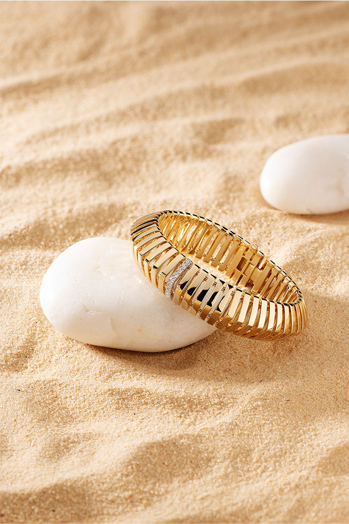 APM Monaco Rayon de Soleil Bracelet in Yellow Gold on beach