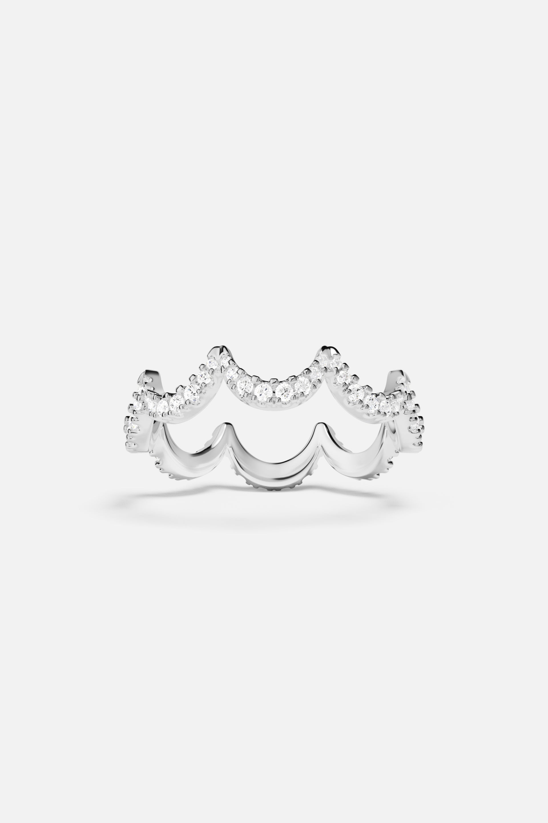 APM Ring in rhodium finish, scalloped waves shimmering with quiet elegance.