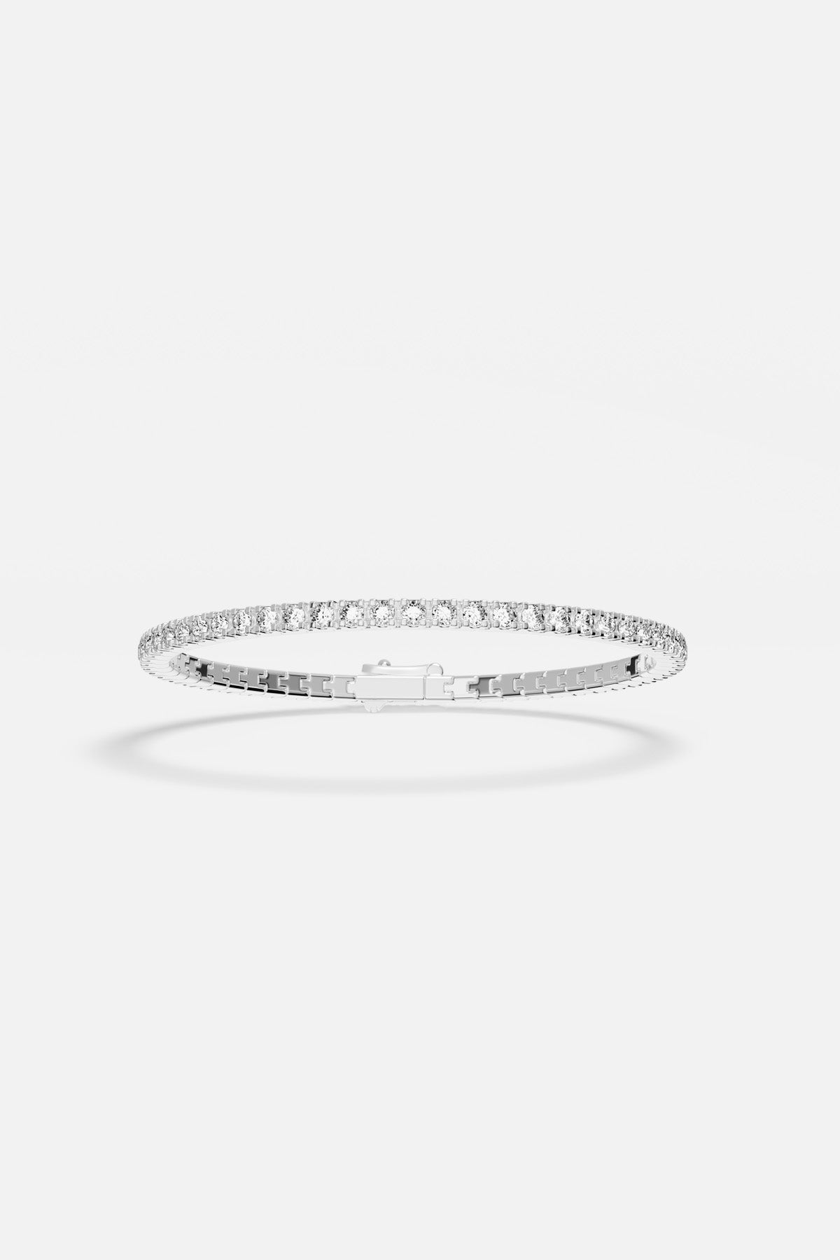 APM Tennis Bracelet in rhodium finish, a timeless sparkle for effortless elegance.