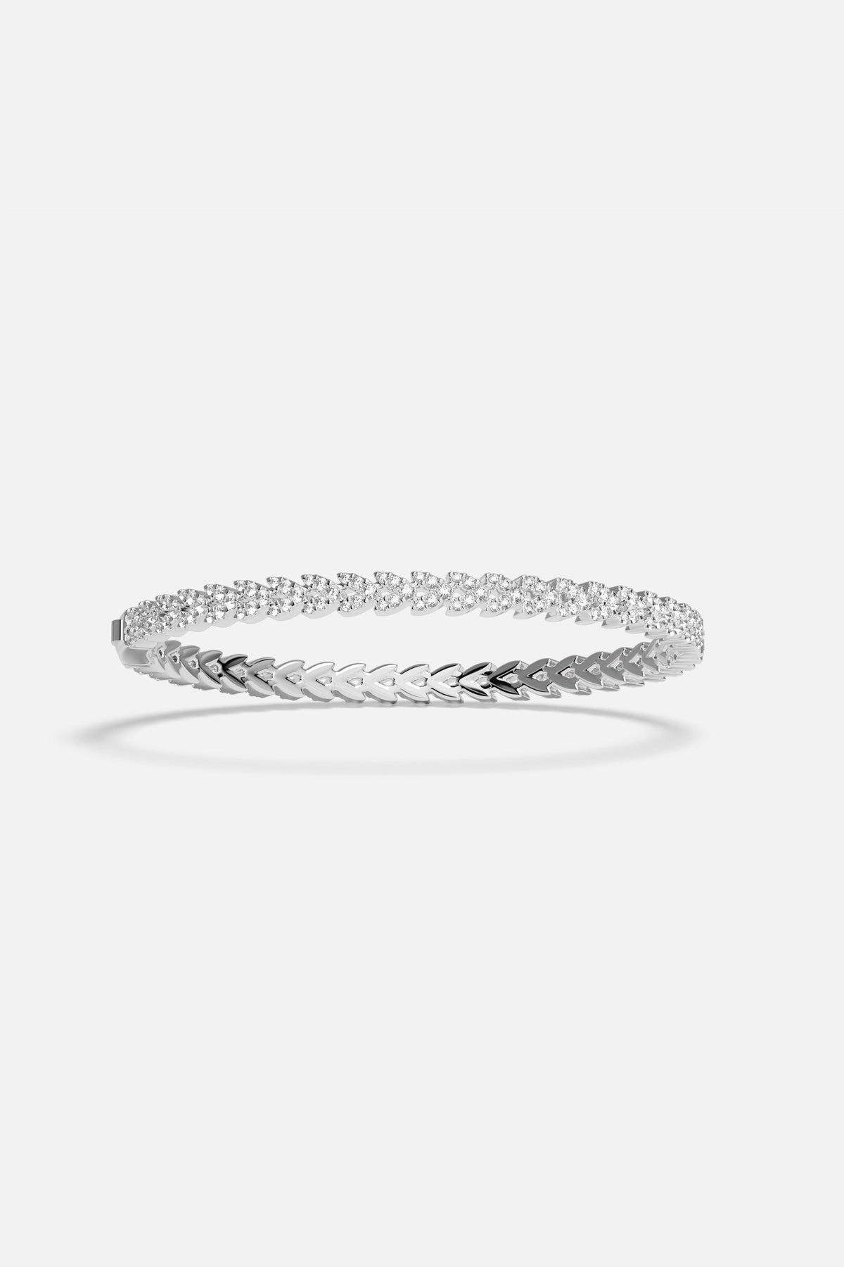 APM Bracelet with a shimmering chevron trail, effortlessly luminous in rhodium finish.