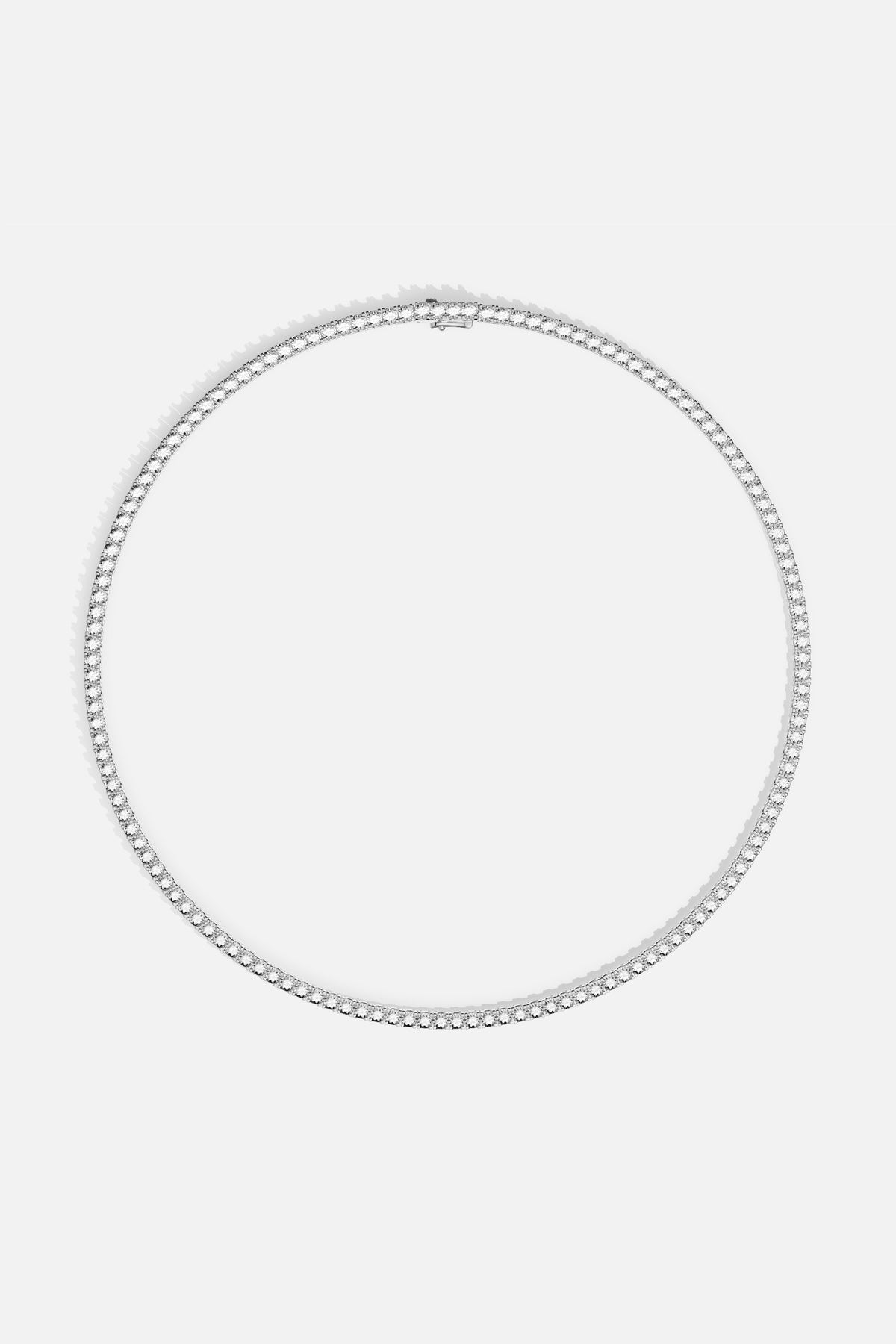 APM Tennis Necklace, a luminous line of brilliance encircling effortless elegance.